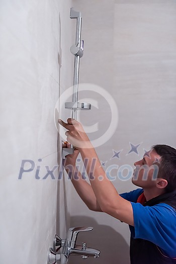 professional plumber working in a bathroom, plumbing repair service, assemble and install concept  plumber tools and equipment in a bathroom