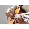 Close up of male hands playing acoustic guitar