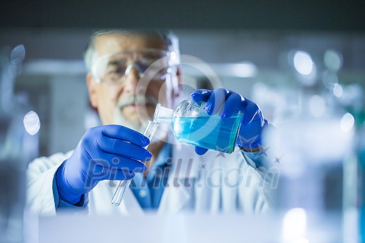 Senior male researcher carrying out scientific research in a lab (shallow DOF; color toned image) Senior male researcher carrying out scientific research in a lab (shallow DOF; color toned image)