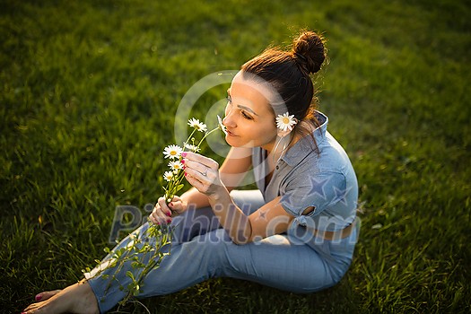 Pretty, young woman in a lovely park, enjoying some free time on a weekend (color toned image) Pretty, young woman in a lovely park, enjoying some free time on a weekend (color toned image)