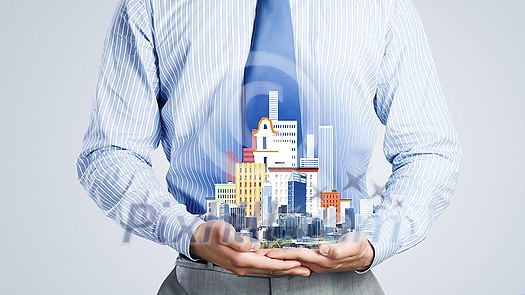 Close up of businessman holding city model in hands Close up of businessman holding city model in hands