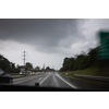 Cars on a highway at a rainy dusk (shallow DOF; color toned image)