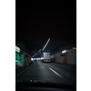 Cars on a highway going through a long modern tunnel (motion blurred image; color toned image)