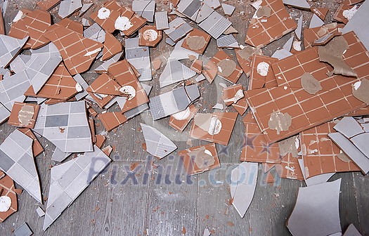 Pile of broken ceramic tiles remains after bathroom renovation prepared to be thrown into the trash Can be use as textured background Pile of broken ceramic tiles remains after bathroom renovation prepared to be thrown into the trash Can be use as textured background