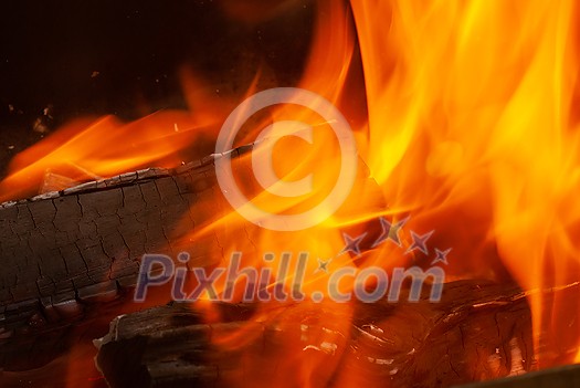 Burning woods open fire background with copy space. Close up view. Can be used for your creativity. Burning woods open fire background with copy space. Close up view. Can be used for your creativity.