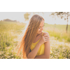 Portrait of young, pretty  woman outdoor on a summer sunny day