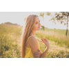 Portrait of young, pretty  woman outdoor on a summer sunny day