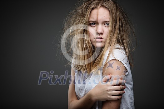 Distressed female teen - victim of domestic violence, abuse - in need of help and protection Distressed female teen - victim of domestic violence, abuse - in need of help and protection