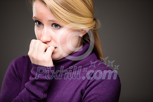 Fear/anxiety/regret/uncertainty in a young woman - effects of a difficult life situation - virus pandemic/confinement concept Fear/anxiety/regret/uncertainty in a young woman - effects of a difficult life situation - virus pandemic/confinement concept