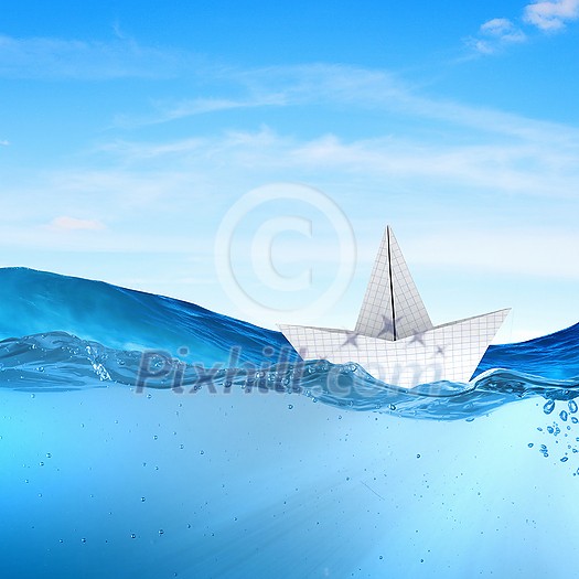 Boat made of paper sailing on blue water surface Boat made of paper sailing on blue water surface