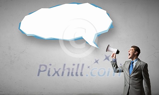 Young businessman with megaphone in hand announcing message Young businessman with megaphone in hand announcing message