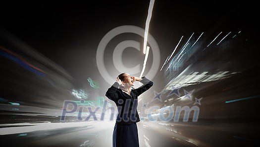 Young frustrated businesswoman covering ears with hands and screaming loud Young frustrated businesswoman covering ears with hands and screaming loud