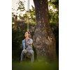 Pretty, young woman with headphones outdoors, in a lovely park, enjoyig the hi-fi quality sound, listening to her favorite songs (color toned image)