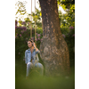 Pretty, young woman with headphones outdoors, in a lovely park, enjoyig the hi-fi quality sound, listening to her favorite songs (color toned image)