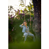 Pretty, young woman with headphones outdoors, in a lovely park, enjoyig the hi-fi quality sound, listening to her favorite songs (color toned image)