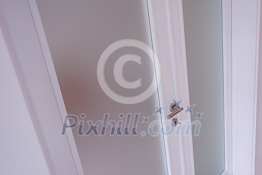 double glass door with white wooden frame in empty room interior double glass door with white wooden frame in empty room interior