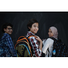 Arabic teenagers, students group  portrait against black chalkboard wearing backpack and books in school