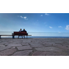 Old Age - Old couple sitting on a bench by the sea (shallow DOF)