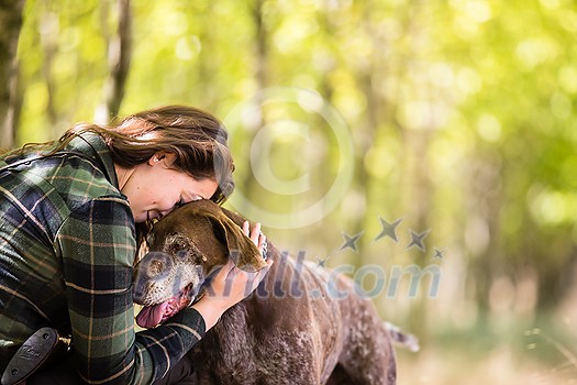Autumn hunting season. Hunting. Outdoor sports. Woman hunter in the woods Autumn hunting season. Hunting. Outdoor sports. Woman hunter in the woods