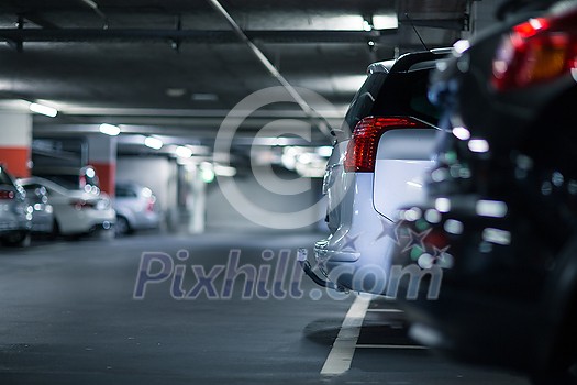 Underground parking/garage (shallow DOF; color toned image) Underground parking/garage (shallow DOF; color toned image)