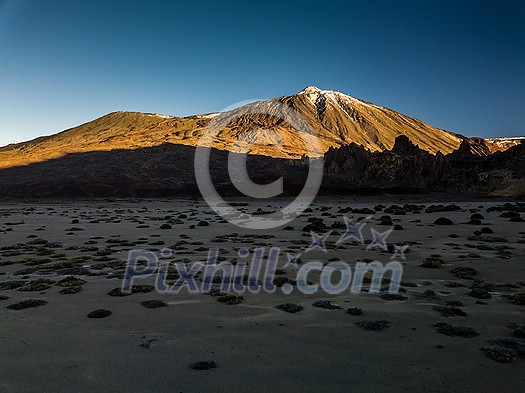 Peaks of Teide and Pico Viejo volcanoes at sunset seen from the Samara crater. Teide National Park, Tenerife, Canary Islands, Spain Peaks of Teide and Pico Viejo volcanoes at sunset seen from the Samara crater. Teide National Park, Tenerife, Canary Islands, Spain