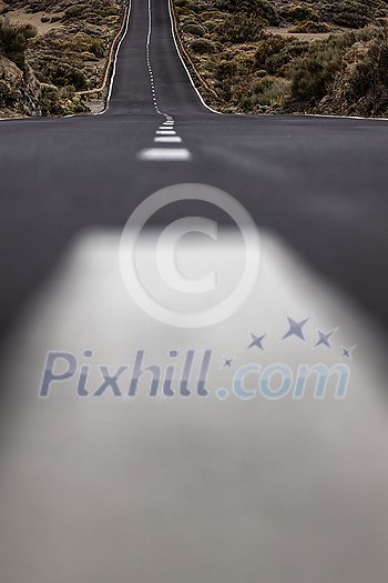 Long road in a mountain valley with a car on it - Teide National Park, Tenerife, Canary islands Long road in a mountain valley with a car on it - Teide National Park, Tenerife, Canary islands