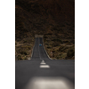 Long road in a mountain valley with a car on it - Teide National Park, Tenerife, Canary islands