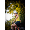 Pretty, young woman biking on a mountain bike enjoying healthy active lifestyle outdoors in summer (shallow DOF)