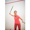 Squash players in action on a squash court (motion blurred image; color toned image)