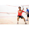 Squash players in action on a squash court (motion blurred image; color toned image)