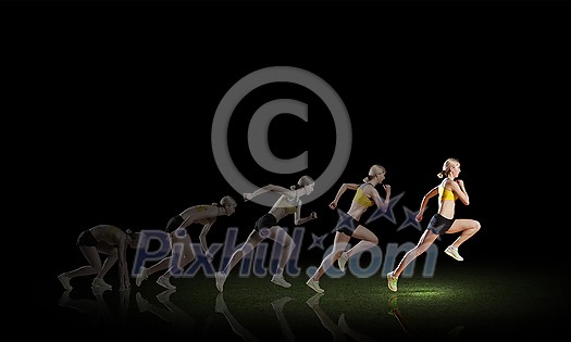Young woman athlete running fast on dark background Young woman athlete running fast on dark background