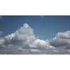 Sunny beautiful cloudyscape on a blue sky background. 4K Timelapse motion of white fluffy cumulus clouds . 4K UHD video 3840, 2160p.