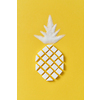 Exotic fruits composition creative pineapple handmade from rafined anf granulated sweet sugar on a yellow background with copy space. Flat lay.