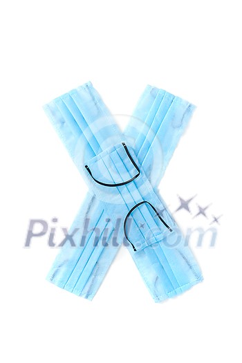 Capital letter X handmade from medical antibacterial protective blue face masks on a white background, copy space. Creative alphabet for making up new words. Capital letter X handmade from medical antibacterial protective blue face masks on a white background, copy space. Creative alphabet for making up new words.