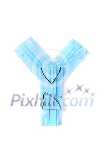 Capital letter Y handmade from medical antibacterial protective blue face masks on a white background, copy space. Creative alphabet for making up new words. Capital letter Y handmade from medical antibacterial protective blue face masks on a white background, copy space. Creative alphabet for making up new words.