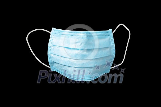 Medical antibacterial protective blue face mask on a black background, copy space. Concept of prevention from respiratory sickness and viruses.