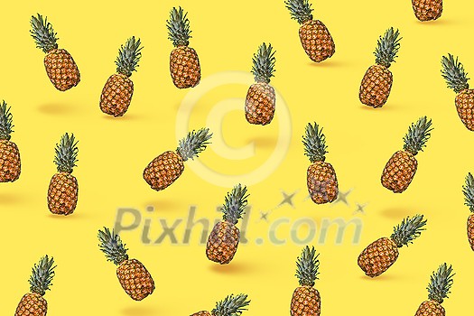 Pattern of slices and whole tropical pineapple fruit on a blue background with space for text. Flat lay Pattern of slices and whole tropical pineapple fruit on a blue background with space for text. Flat lay