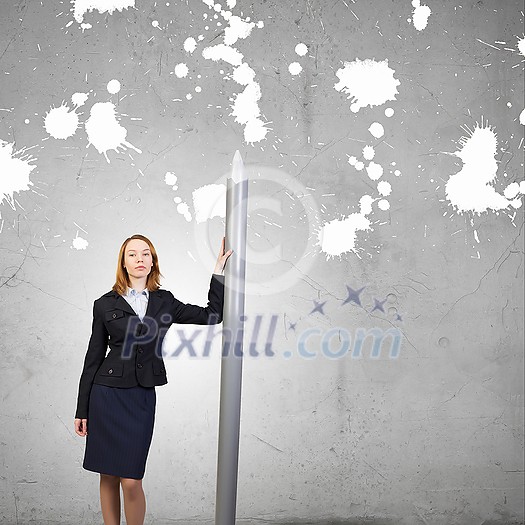 Young businesswoman with big pencil in hands Young businesswoman with big pencil in hands