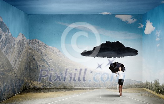 Bad luck and crisis concept with young businesswoman with black umbrella Bad luck and crisis concept with young businesswoman with black umbrella