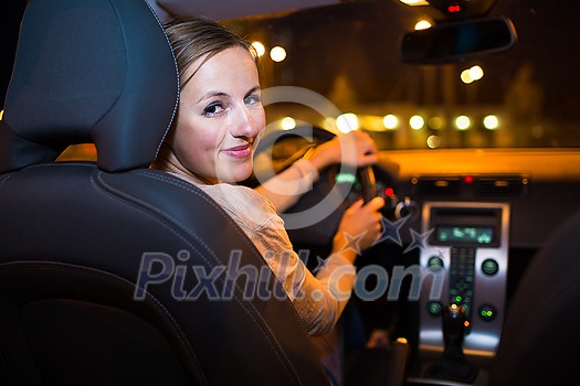 Pretty young woman driving her new car Pretty young woman driving her new car