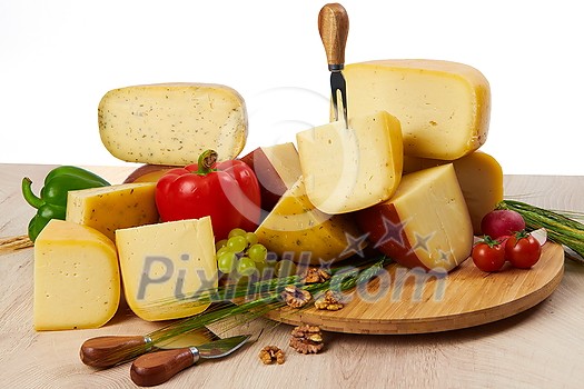 Organic Cheese healthy gourment food produced on local farm assortment on wooden background Organic Cheese healthy gourment food produced on local farm assortment on wooden background