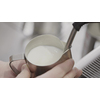 The process of making milk foam. Barista whips milk in a coffee machine. Slow motion, Full HD video, 240fps, 1080p.