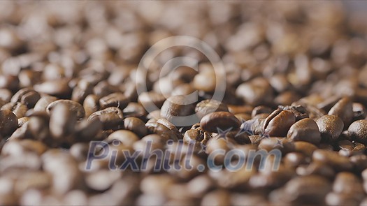 Closeup of splashing falling fragrant roasted coffee beans. Slow motion, Full HD video, 240fps, 1080p. Closeup of splashing falling fragrant roasted coffee beans. Slow motion, Full HD video, 240fps, 1080p.