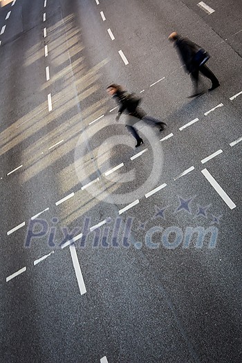 City business people crossing a street - motion blurred abstract background