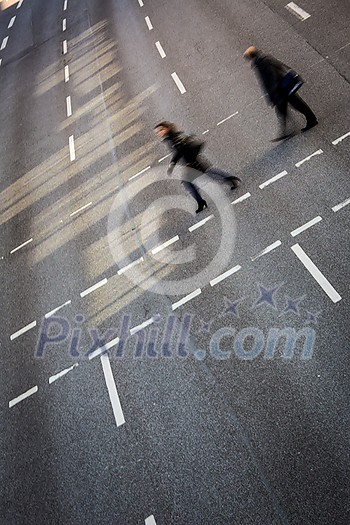City business people crossing a street - motion blurred abstract background City business people crossing a street - motion blurred abstract background