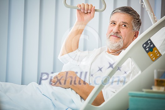 Senior male patient in a modern hospital (shallow DOF; color toned image) Senior male patient in a modern hospital (shallow DOF; color toned image)