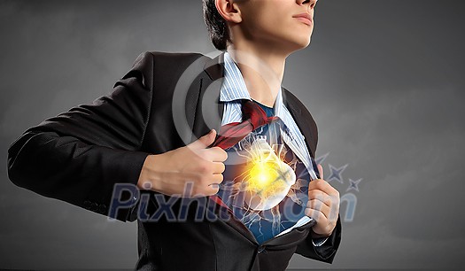 Businessman opening his shirt on chest acting like super hero Businessman opening his shirt on chest acting like super hero