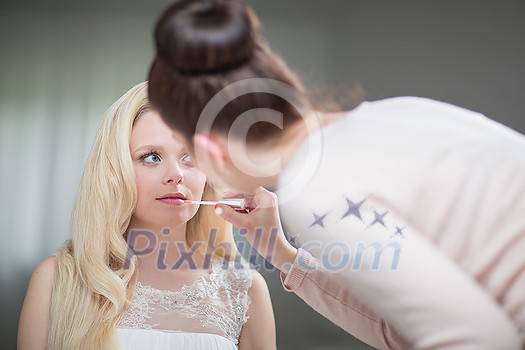 Beautiful bride with fashion wedding hairstyle. Closeup portrait of young gorgeous bride. Wedding Studio shot (color toned image; shallow DOF)