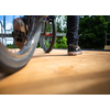 Bmx rider jumping over on a U ramp in a skatepark (motion blurred image)