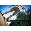 Skteboarder riding in an U ramp in a skatepark (motion blurred image)